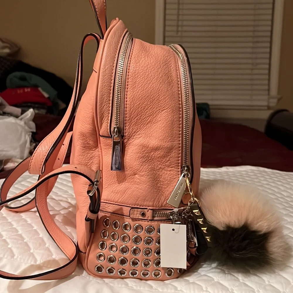 Michael Kors Rhea Medium Silver-Ringed Backpack with Fur Pompom in Coral…